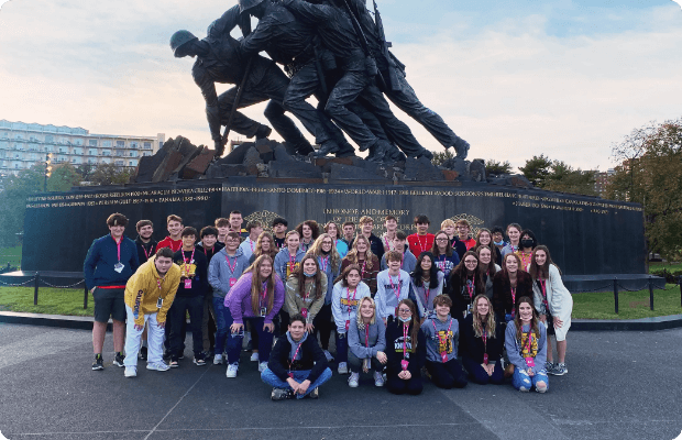 student group in front of statue in Washington, D.C.